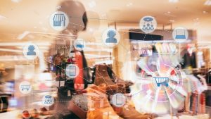 Adobe Stock_Multichannel Modegeschäft, über dem viele kleine Icons schweben, die miteinander verbunden sind; als Beispiel für nahtlose Kundenerlebnis über alle Einkaufskanäle hinweg.